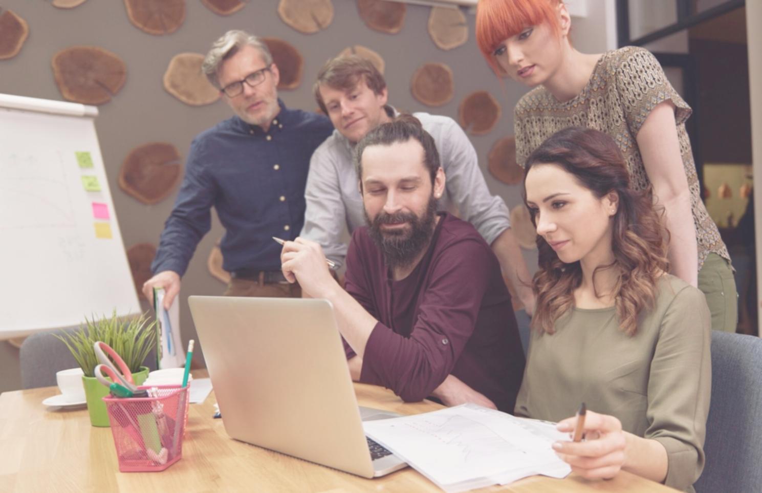 Person reviewing financial documents at a clean desk workspace